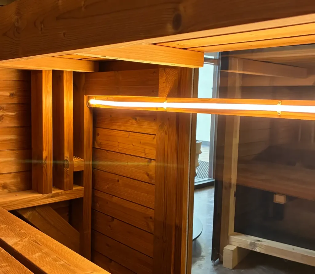 A close-up of a light bar running through a Traditional Mod Pod Sauna.