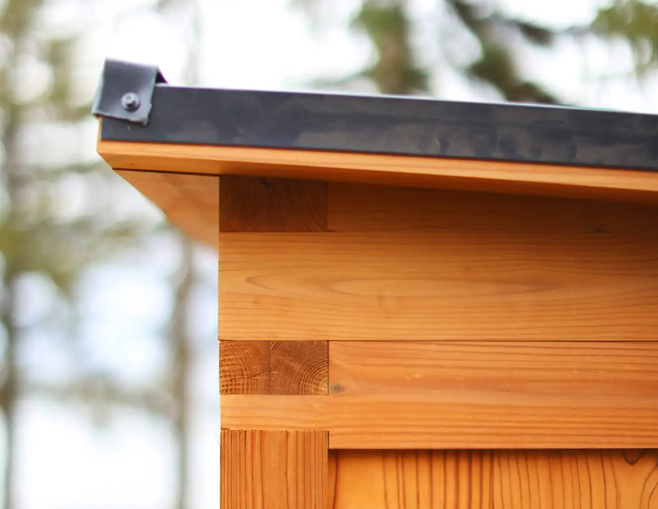 A close-up shot of the corner of the mono-pitch roof on a Traditional Mod Pod Sauna.