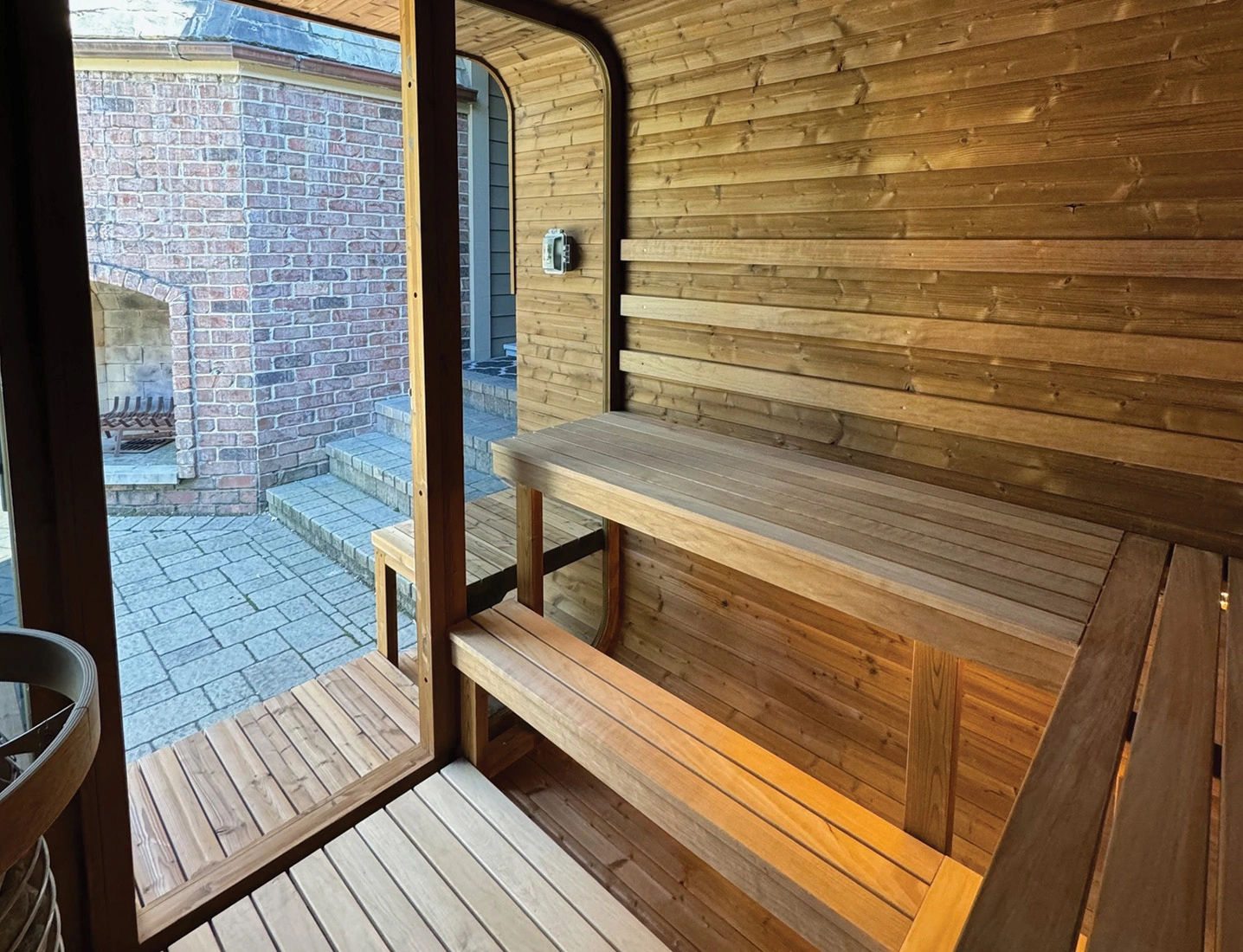 angle interior view looking out door and windows or square sauna